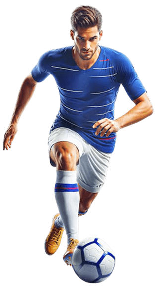 A soccer player in a blue jersey and white shorts strides forward, dribbling a soccer ball. He wears yellow cleats and focused expression, against a plain background.